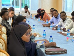 Training participant keenly listening to a session by facilitator on Building Resilience